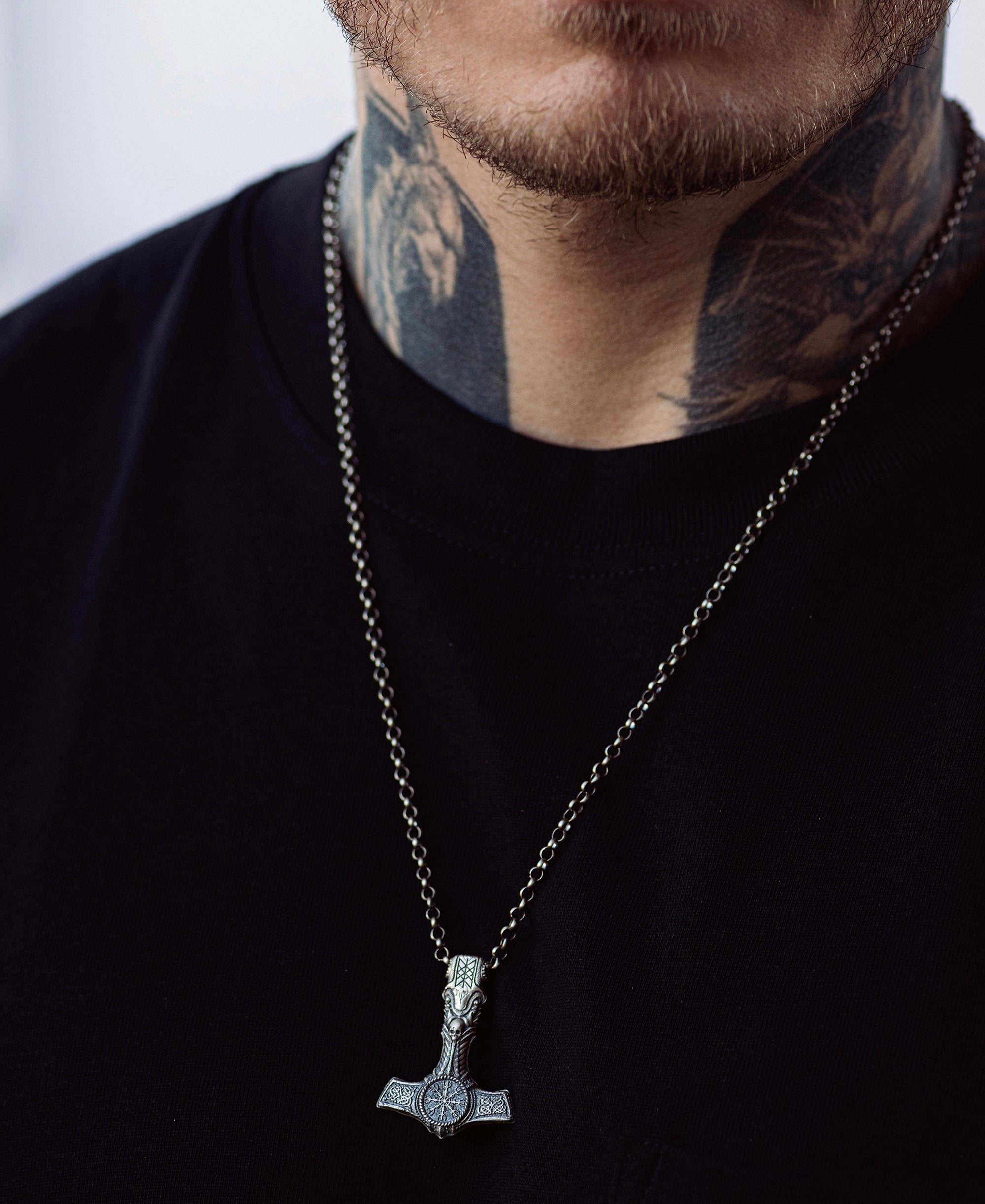 Man wearing a handcrafted silver chain necklace with pendant — REYTEL Jewelry