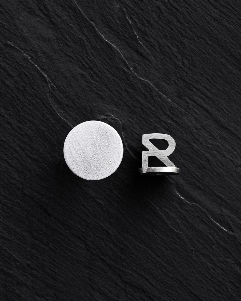 Silver single earring PUNKT