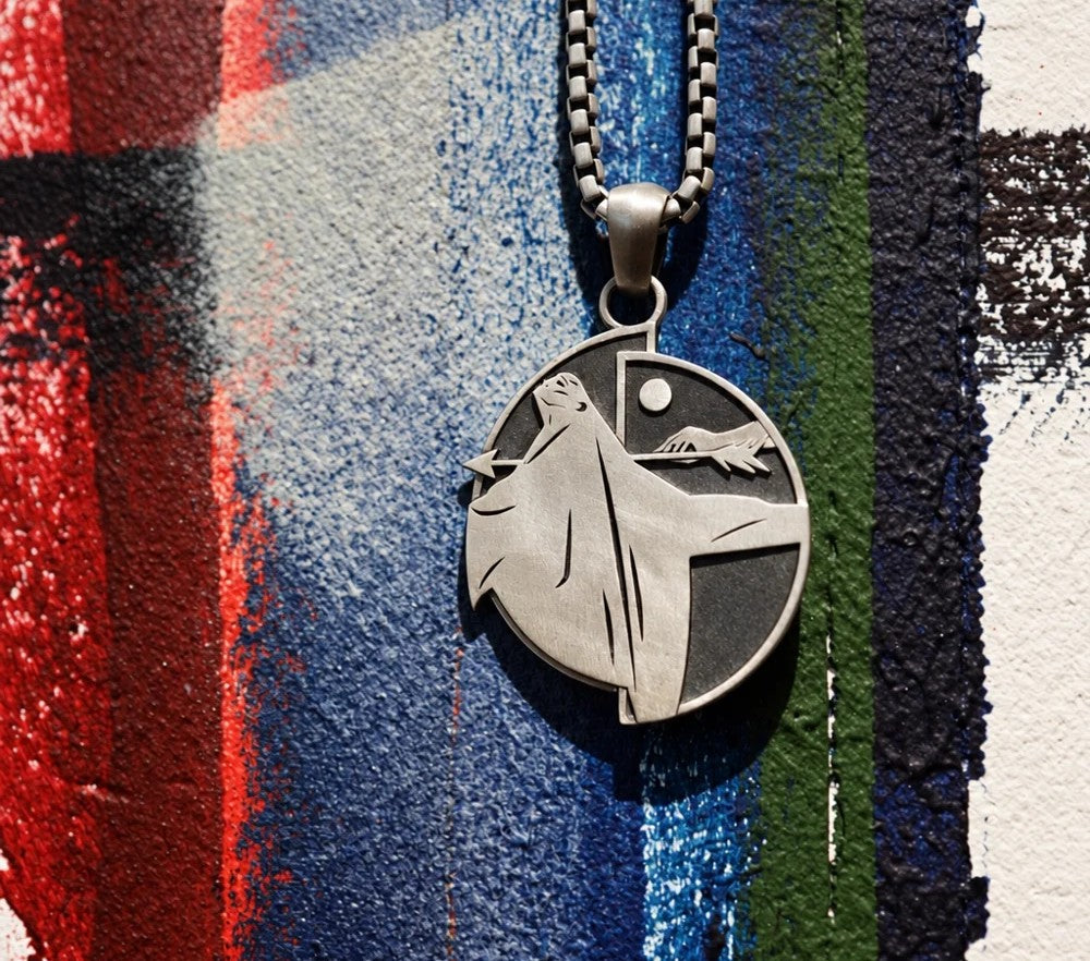 HUNTING FOR LIFE pendant on a painted canvas